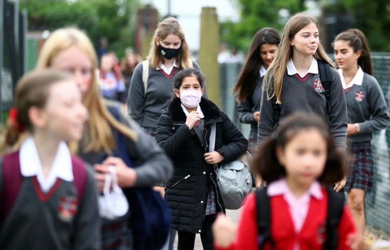 Pupils arrive at Lady Eleanor Holles on their first day of school, amid the outbreak of the coronavirus disease (COVID-19)