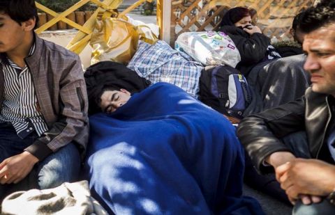 A young Afghan sleeps at Victoria Square. Athens. Hundreds are now caught there since States along the Balkan Route tightened borders.