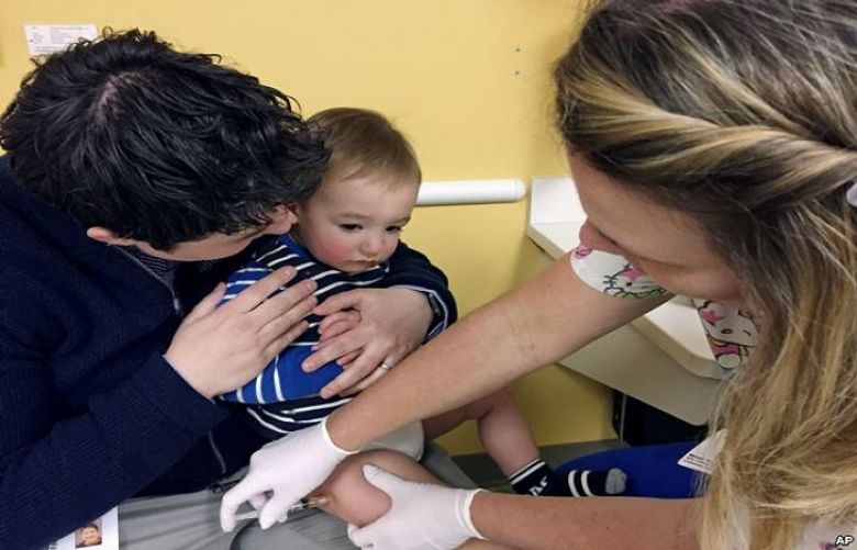 FILE - 15-month-old August Goepferd received the measles, mumps and rubella booster shot at a clinic at Children&#039;s Minnesota in Minneapolis.