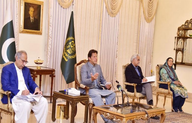 Prime Minister Imran Khan talking to senior journalists in Islamabad on Friday
