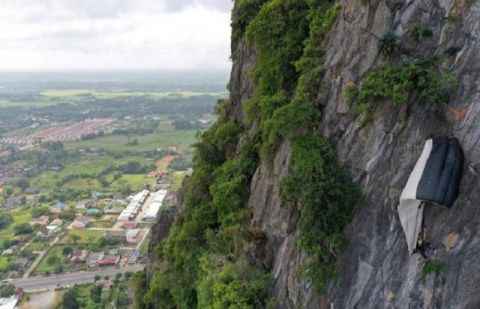 Hanging around: BASE jumper saved from Thai cliff after parachute snags