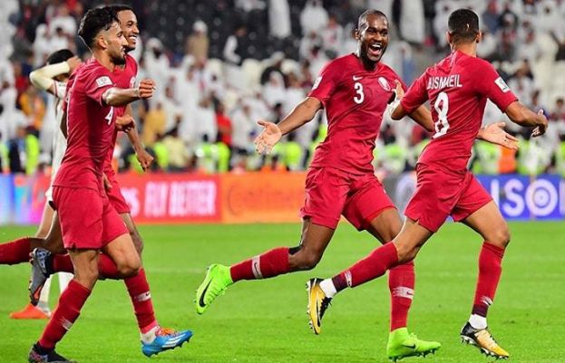 Qatar's defender Hamid Ismeil (R) celebrates his goal during the 2019 AFC Asian Cup semi-final football match between Qatar and UAE at the Mohammed Bin Zayed Stadium in Abu Dhabi on January 29, 2019.