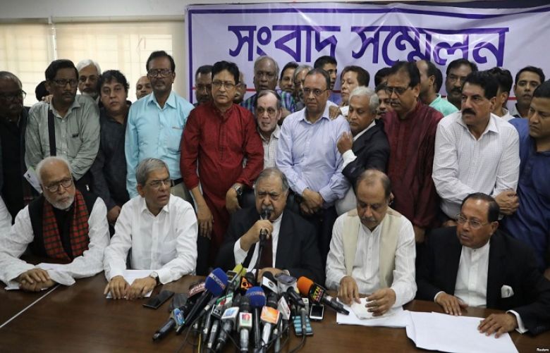 Members of Jatiya Oikyafront, an opposition alliance, hold a news conference at the National Press Club to confirm their participation in the upcoming parliamentary election in Dhaka, Bangladesh, Nov. 11, 2018.