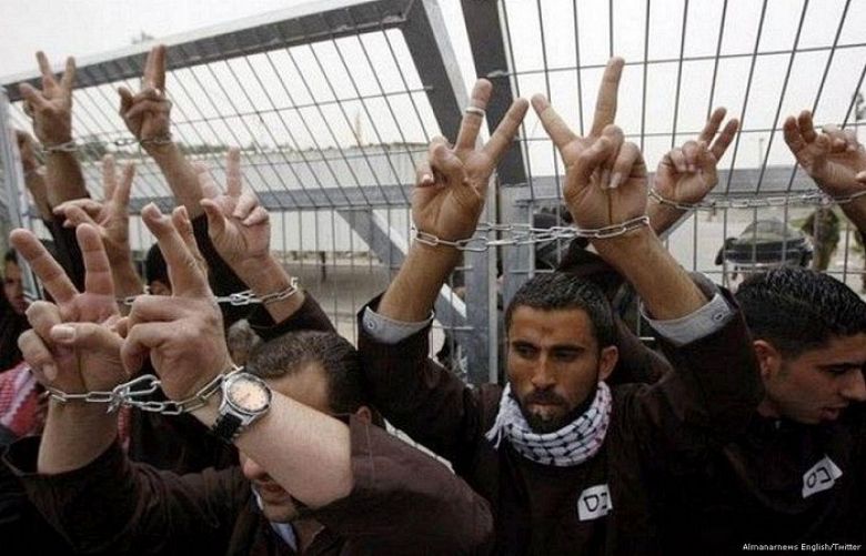 Palestinian activists take part in a protest in solidarity with Palestinian prisoners in Israeli prisons [File photo]