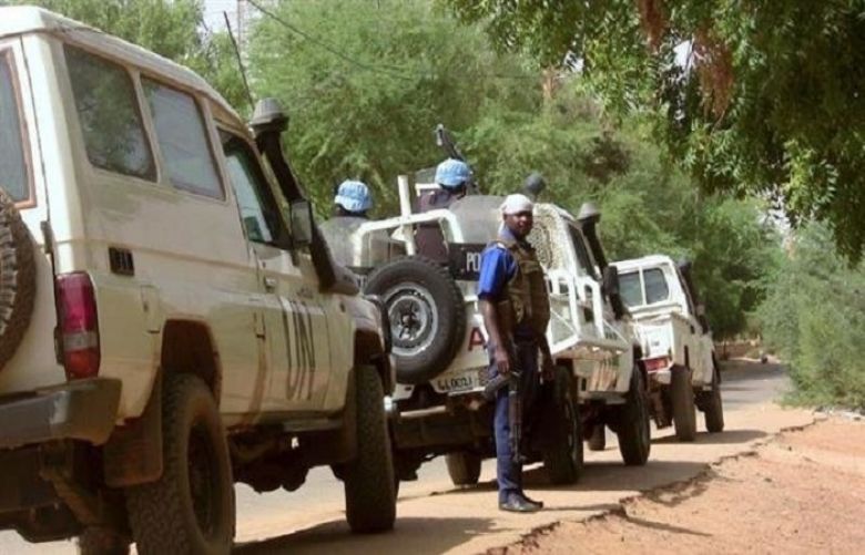 This file photo shows Malian police patrolling with personnel from the UN mission in Mali, or MINUSMA, in Gao, northern Mali, on May 18, 2016.