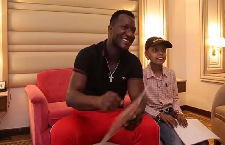 In this screenshot taken from a video uploaded on Zalmi TV&#039;s YouTube channel, Sammy meets his young fan.
