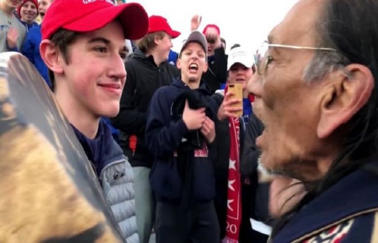 Nick Sandmann (left) and Nathan Phillips (right) both said they were trying to defuse tensions