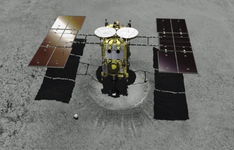 This computer graphic image provided by the Japan Aerospace Exploration Agency (JAXA) shows the Japanese unmanned spacecraft Hayabusa2 approaching on the asteroid Ryugu.