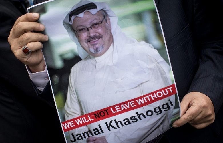 A man holds a poster of Saudi journalist Jamal Khashoggi during a protest organized by members of the Turkish-Arabic Media Association at the entrance to Saudi Arabia&#039;s consulate in Istanbul, Turkey on October 8, 2018. 