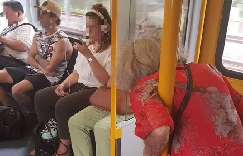 The four passengers appeared not to give up their seat for the elderly woman on the train. Credit: Facebook