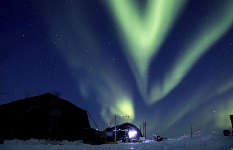 In this March 9, 2018, photo provided by the U.S. Navy, the aurora borealis displays above Ice Camp Skate in the Beaufort Sea. Scientists are seeing melting in polar regions at times they don&#039;t expect, like winter, and in places they don&#039;t expect, like eastern Antarctica.