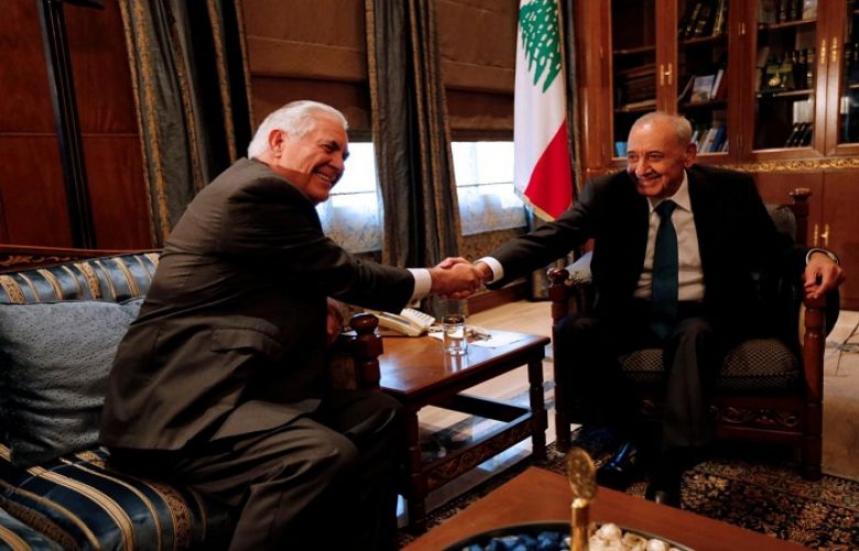 Lebanese Parliament Speaker Nabih Berri shakes hands with U.S. Secretary of State Rex 