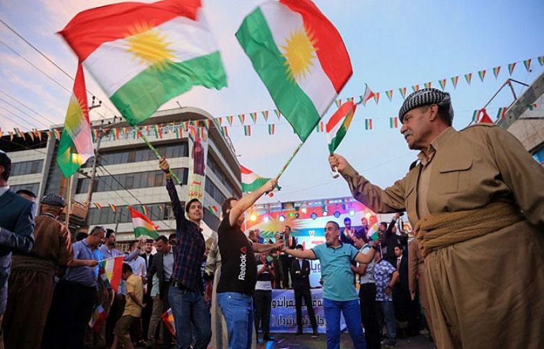 Kurds celebrate to show their support for the independence referendum in Duhok, Iraq, September 26, 2017. 