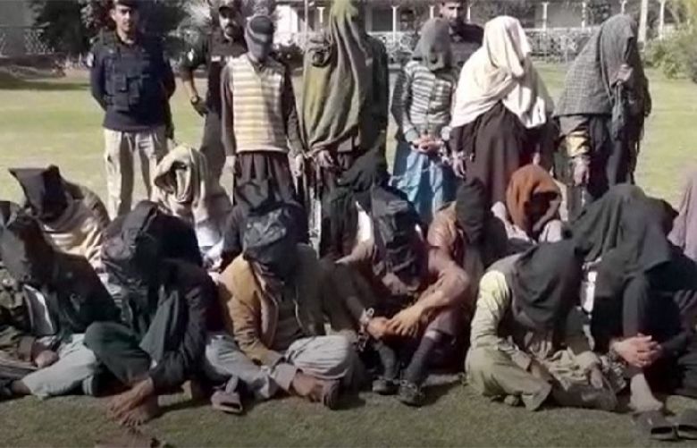 Scores of suspected drug peddlers pictured after their arrest by Peshawar police on February 23, 2019.