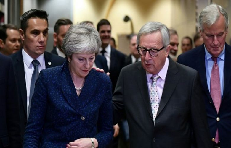 Theresa May met European Commission President Jean-Claude Juncker on the eve of a summit to approve a historic Brexit deal. 