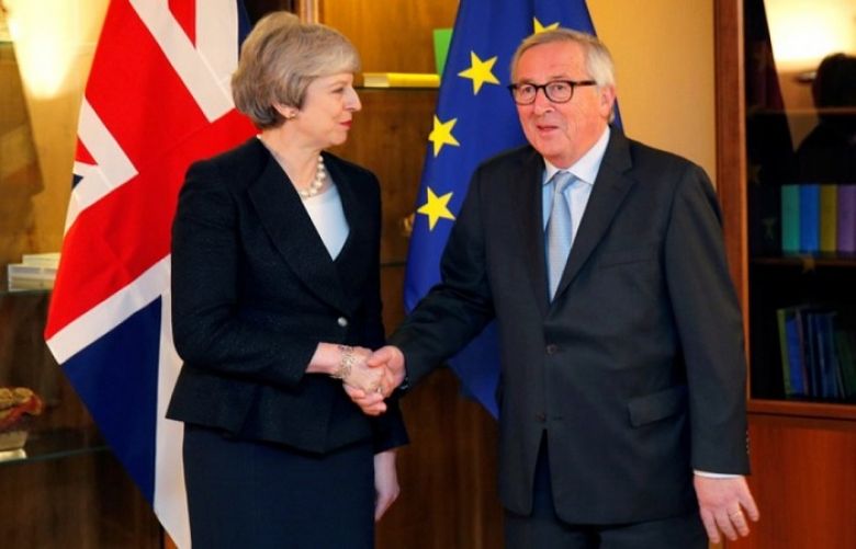 EU holds ground on Brexit after PM May announces resignation