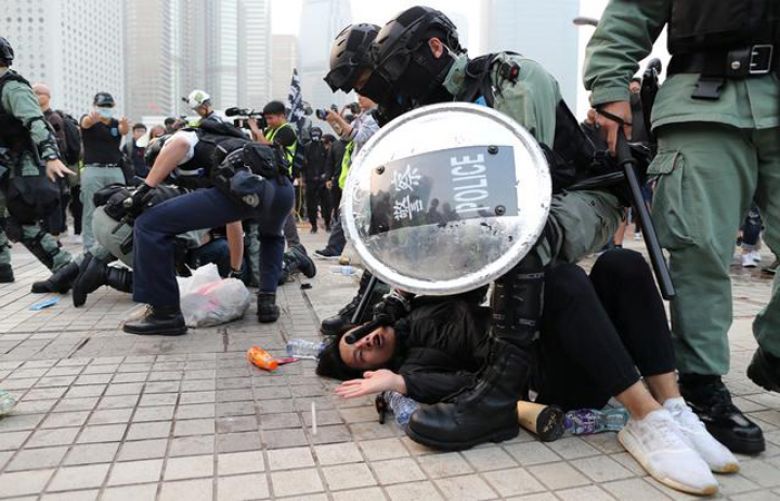 Clashes as police try to clear Hong Kong protesters after Uighur support rally