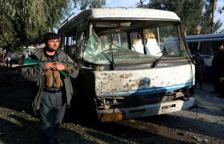 A member of the Afghan security forces stands guard near the site of a suicide attack in Jalalabad