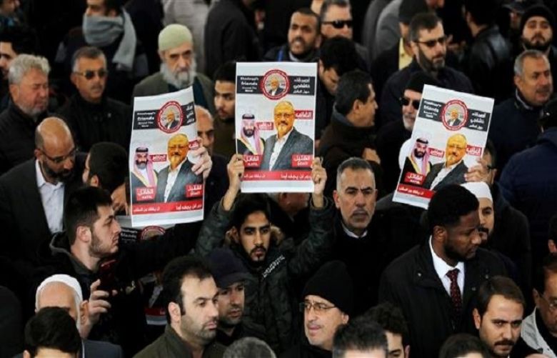 People hold pictures of Saudi journalist Jamal Khashoggi as they attend a symbolic funeral prayer at the courtyard of Fatih Mosque in Istanbul, Turkey, November 16, 2018. 