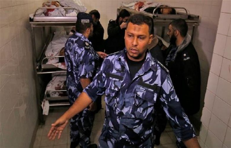 Palestinian security forces gather at a hospital morgue, where the bodies of five of the six men killed during an Israeli operation on the city of Khan Yunis in the southern Gaza Strip were transported on November 11, 2018. 