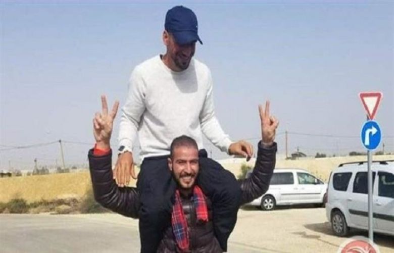 This photo shows Palestinian prisoner Abed al-Rahman Khalil Mahmoud (on top) shortly after being released from an Israeli jail on February 24, 2019.