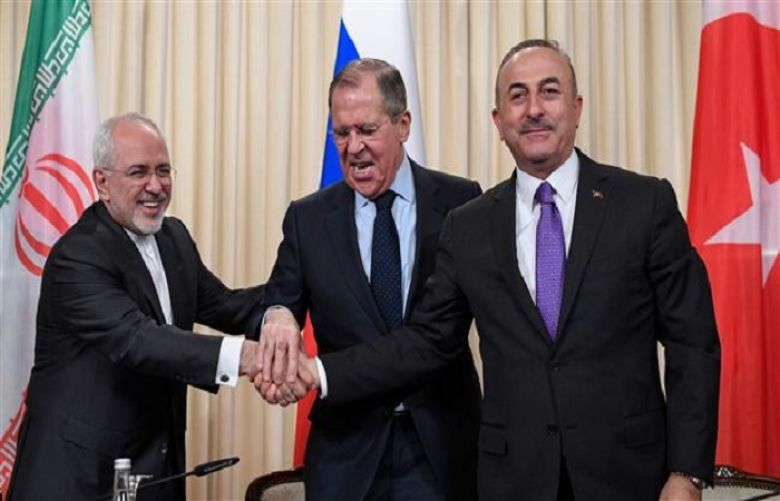 Iranian Foreign Minister Mohammad Javad Zarif and his Russian and Turkish counterparts Sergei Lavrov and Mevlut Cavusoglu