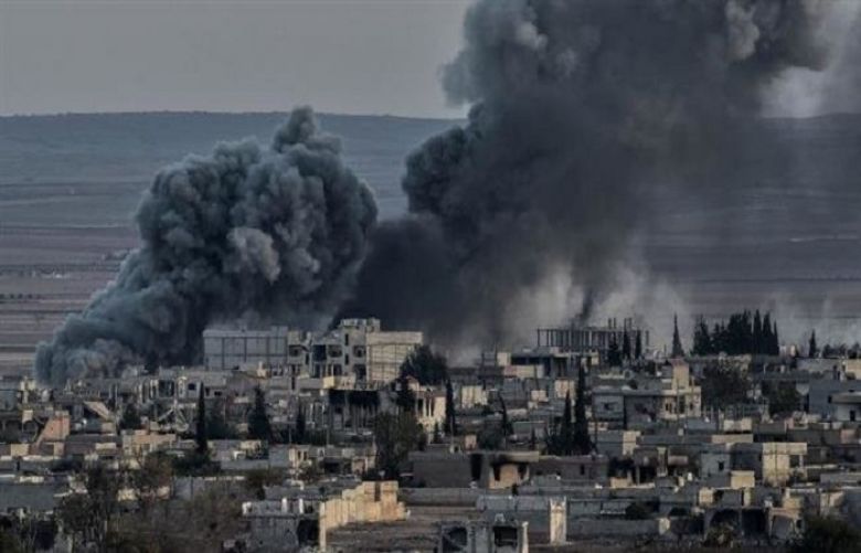 In this file picture, smoke rises after an airstrike from US-led coalition in the city of Kobane, also known as Ain al-Arab, seen from the southeastern border village of Mursitpinar, Sanliurfa province, Turkey. 