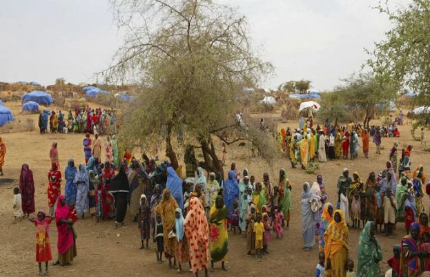 Displaced people gather in the Zam Zam refugee camp in the Darfur region