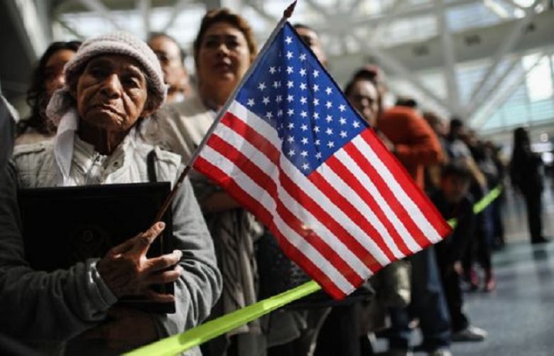 Ana Julia Ayala, an immigrant from El Salvador, waits for her son to depart a naturalization ceremony on March 20, 2018, in Los Angeles, California. The naturalization ceremony welcomed more than 7,200 immigrants from over 100 countries who took the citizenship oath and pledged allegiance to the American flag. 