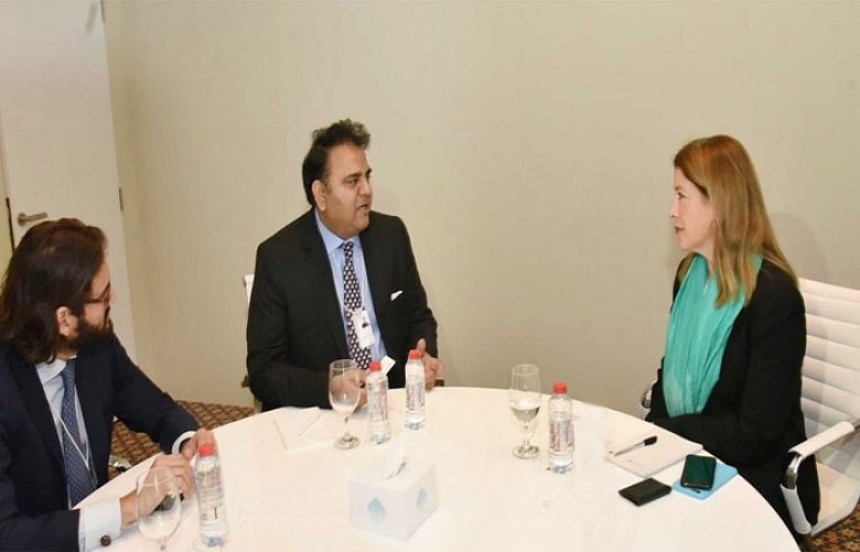 Information Minister Fawad Chaudhary talks with Senior Vice President American company Krista Pilot