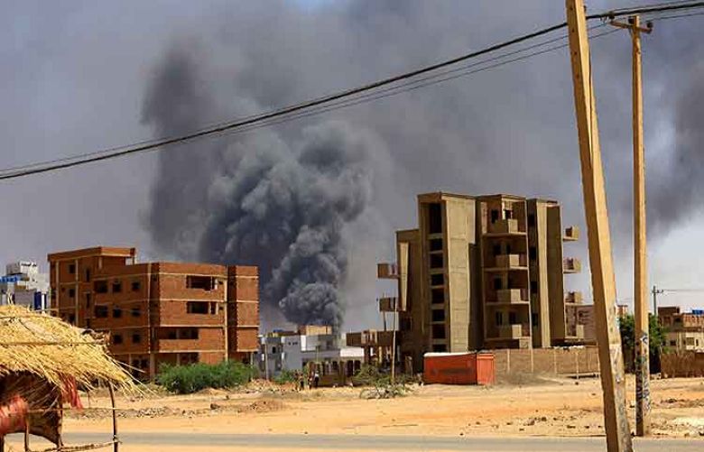 Smoke rises above buildings after an aerial bombardment in Khartoum, Sudan.