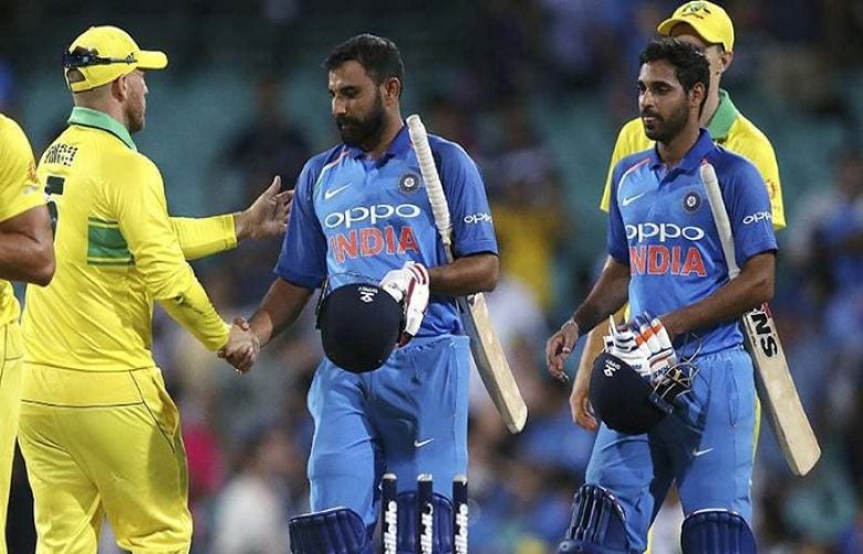 Australia&#039;s captain Aaron Finch, left, shakes hands with India&#039;s Mohammed Shami, centre, and Bhuvneshwar Kumar, right, at the end of the match.