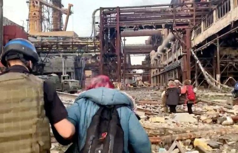 Dozens of civilians have left a besieged steel plant in the Ukrain