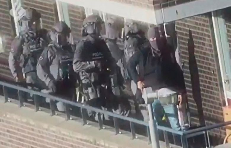 Dutch police special forces raid a house in Arnhem, Netherlands, September 27, 2018. 