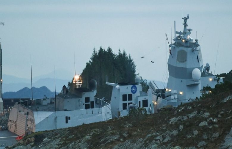 The Norwegian frigate KNM Helge Ingstad takes on water after a collision with the tanker Sola TS, in Oygarden, Norway, Thursday Nov. 8, 2018. Norway&#039;s military says the 127-man crew on a Navy frigate has been evacuated after the ship was rammed by a Malta-flagged tanker while docked in a Norwegian harbor. Seven people were slightly injured.