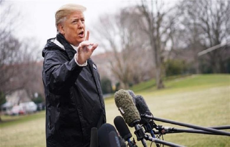US President Donald Trump speaks to the press before boarding Marine One at the White House on March 8, 2019, in Washington, DC. 