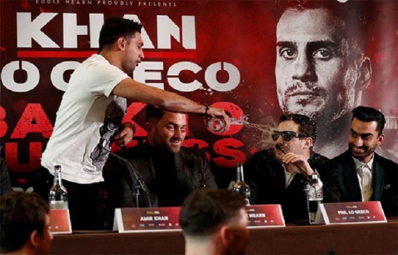 Amir Khan threw water over Phil Lo Greco after being taunted by the Canadian.