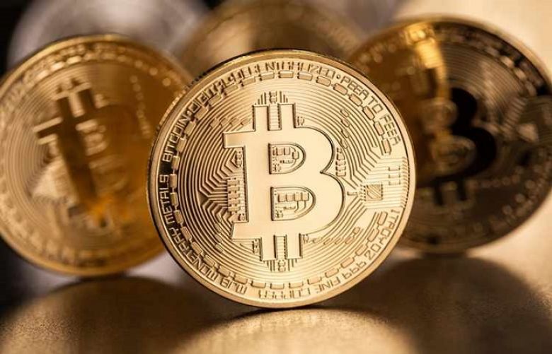 Bitcoin holds above $7,000 after hitting nine-month high