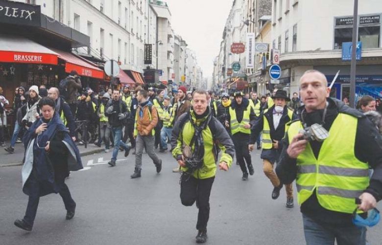Thousands march as France’s ‘yellow vest’ protests rumble on