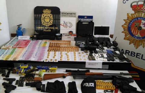 Gold ingots, guns and euros, which were seized by Spanish police, after they arrested a French gang in Marbella for holding a Frenchman hostage for two months.