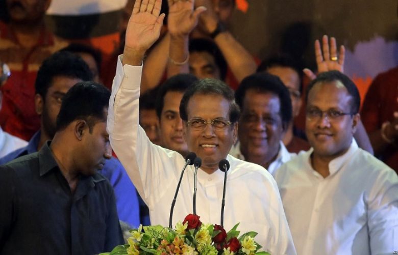 Sri Lankan President Maithripala Sirisena waves to supporters during a rally outside the parliamentary complex in Colombo, Sri Lanka, Nov. 5, 2018.