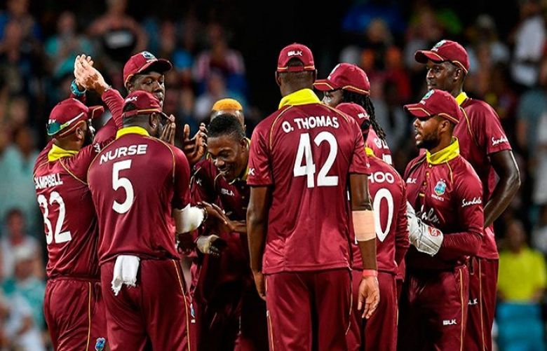 Sheldon Cottrell (C) of West Indies celebrates the dismissal of Moeen Ali of England during the 2nd ODI between West Indies and England at Kensington Oval