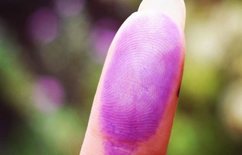 Voters show off their inked thumbs #PakistanKoVoteDo