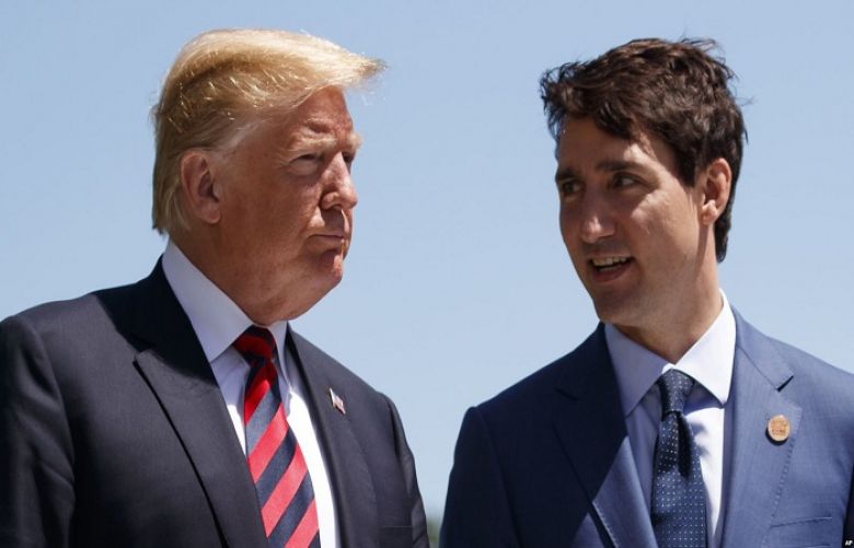 President Donald Trump talks with Canadian Prime Minister Justin Trudeau during a G-7 Summit welcome ceremony, June 8, 2018, in Charlevoix, Canada.
