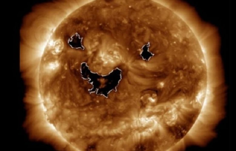 Eerie image of the sun &#039;smiling&#039; captured by NASA