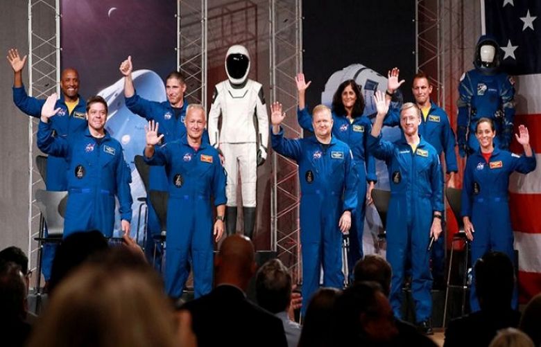 Nasa names astronauts for first commercial flights