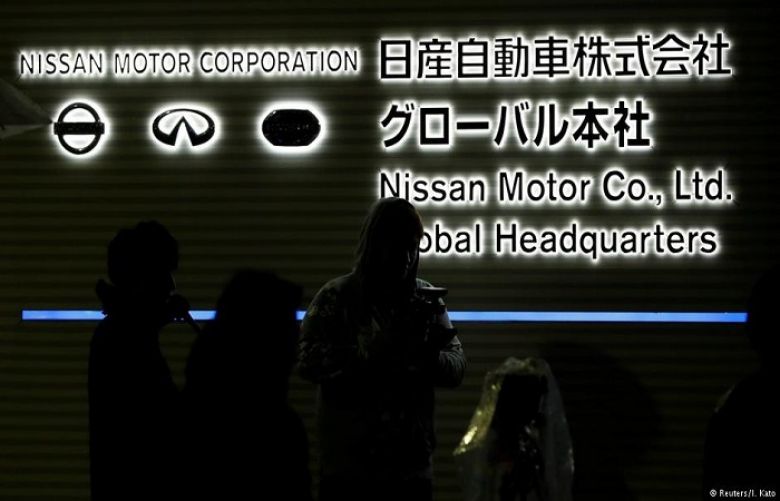 Reporters gather at Nissan&#039;s global HQ in Yokohama, Japan on Monday evening ahead of a news conference