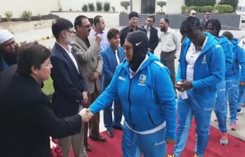 The West Indies women’s cricket team shaking hands with PCB officials at Karachi International Airport.