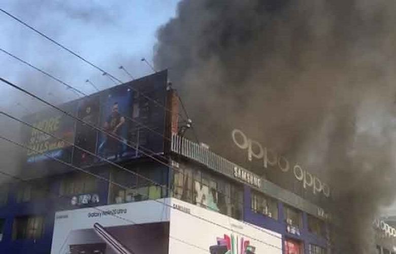 Smoke rises from the Hafeez Centre building in Lahore&#039;s Gulberg Main Boulevard