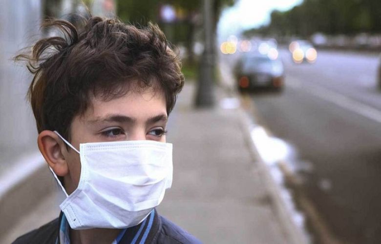 Child protecting itself from air pollution